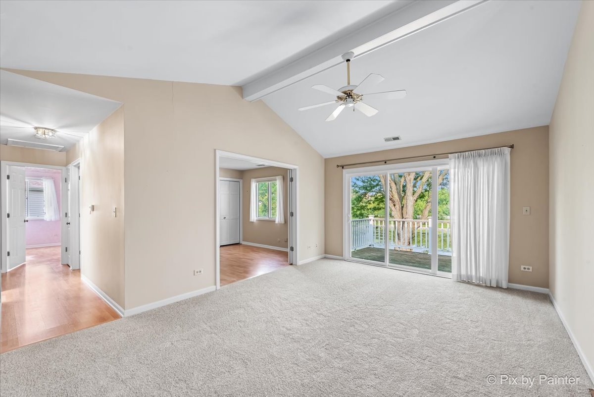 -n021 Windermere Road, Unit 405 Winfield, IL 60190 - Photo 6 of 50 a view of empty room with wooden floor and fan