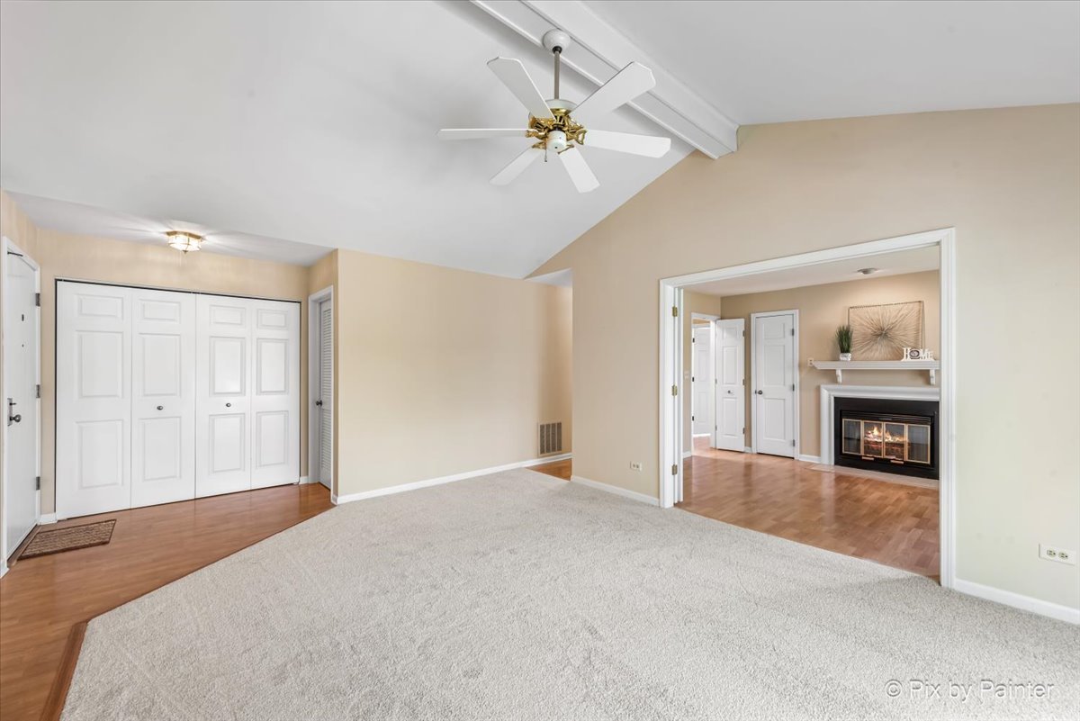 -n021 Windermere Road, Unit 405 Winfield, IL 60190 - Photo 7 of 50 a bedroom with a bed and a chandelier