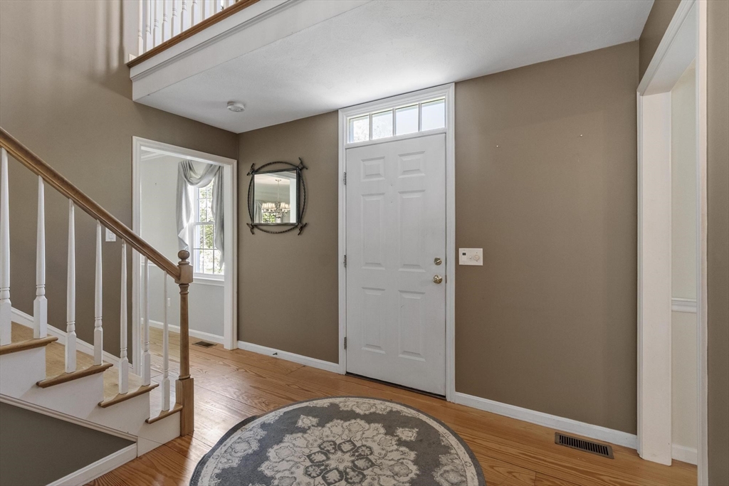 4 Ridge Road Pepperell, MA 01463 - Photo 8 of 42 a view of an entryway with wooden floor