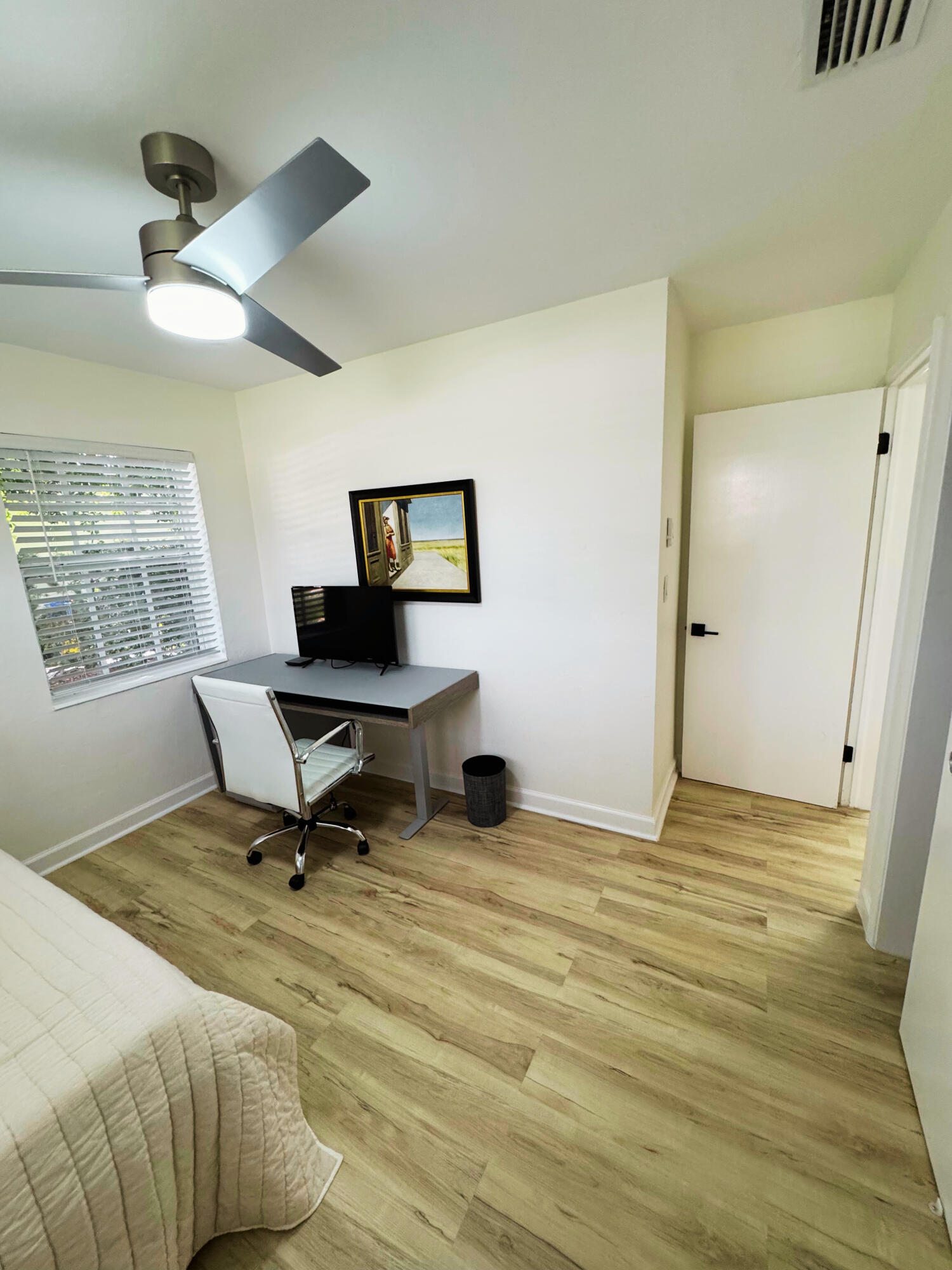 300 Northeast 7th Street Boca Raton, FL 33432 - Photo 10 of 16 a view of a workspace with furniture and a window