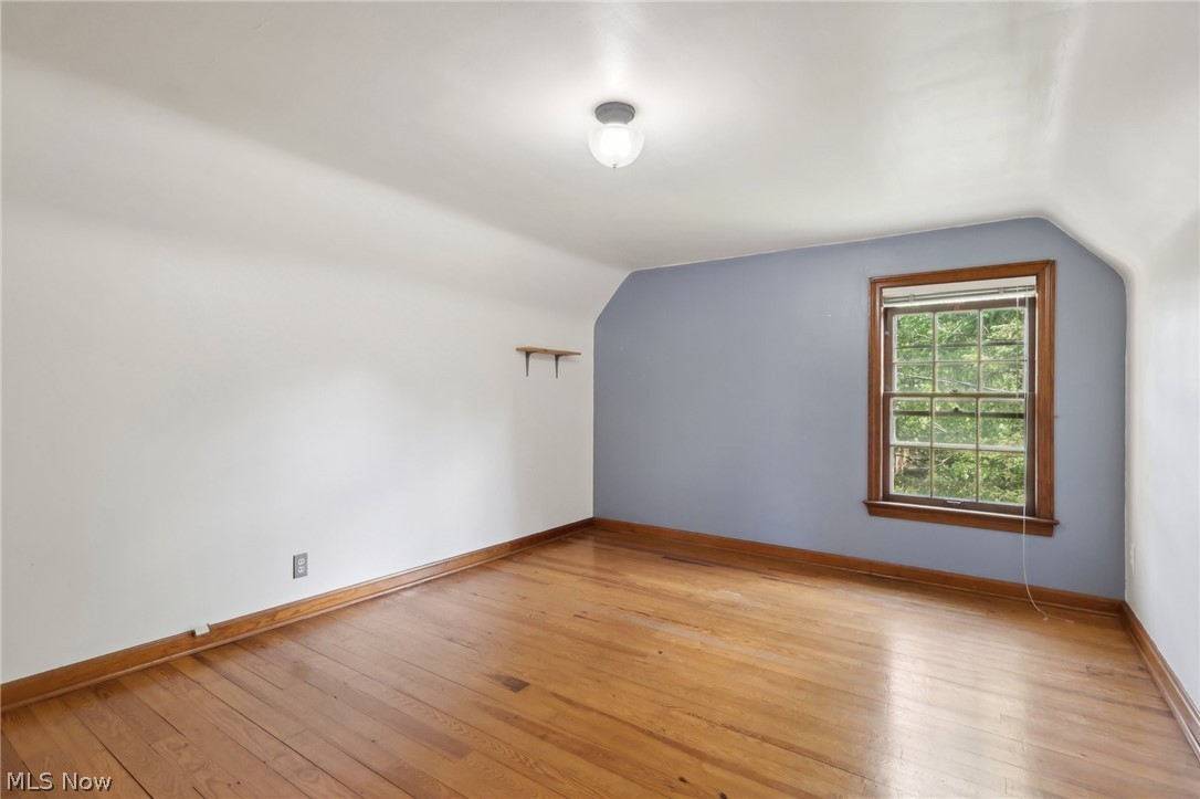 2620 Charney Road Cleveland, OH 44118 - Photo 28 of 43 Additional living space featuring light wood-type flooring and vaulted ceiling