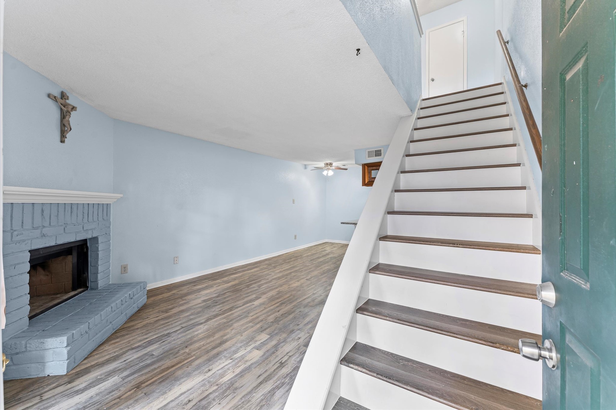 7402 Alabonson Road, Unit 303 Houston, TX 77088 - Photo 11 of 20 a view of entryway and hall with wooden floor