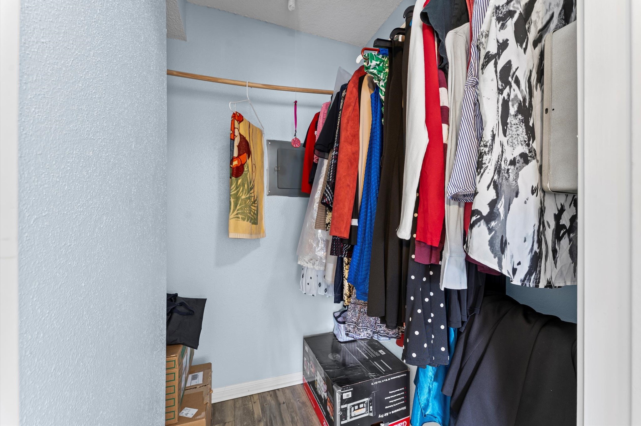 7402 Alabonson Road, Unit 303 Houston, TX 77088 - Photo 14 of 20 a view of walk in closet with clothes