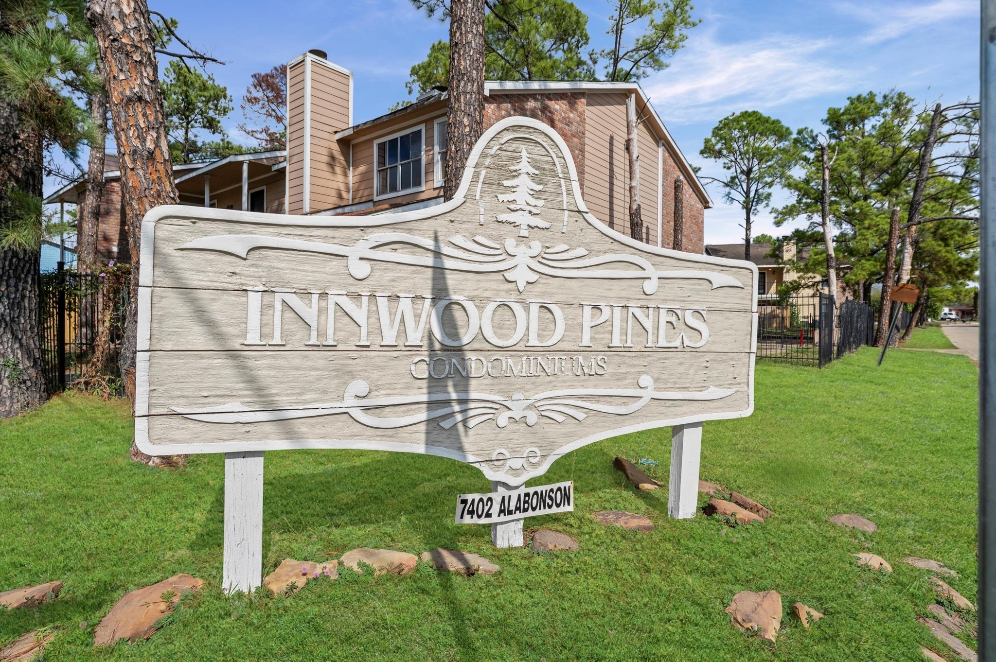 7402 Alabonson Road, Unit 303 Houston, TX 77088 - Photo 2 of 20 a front view of a house with garden
