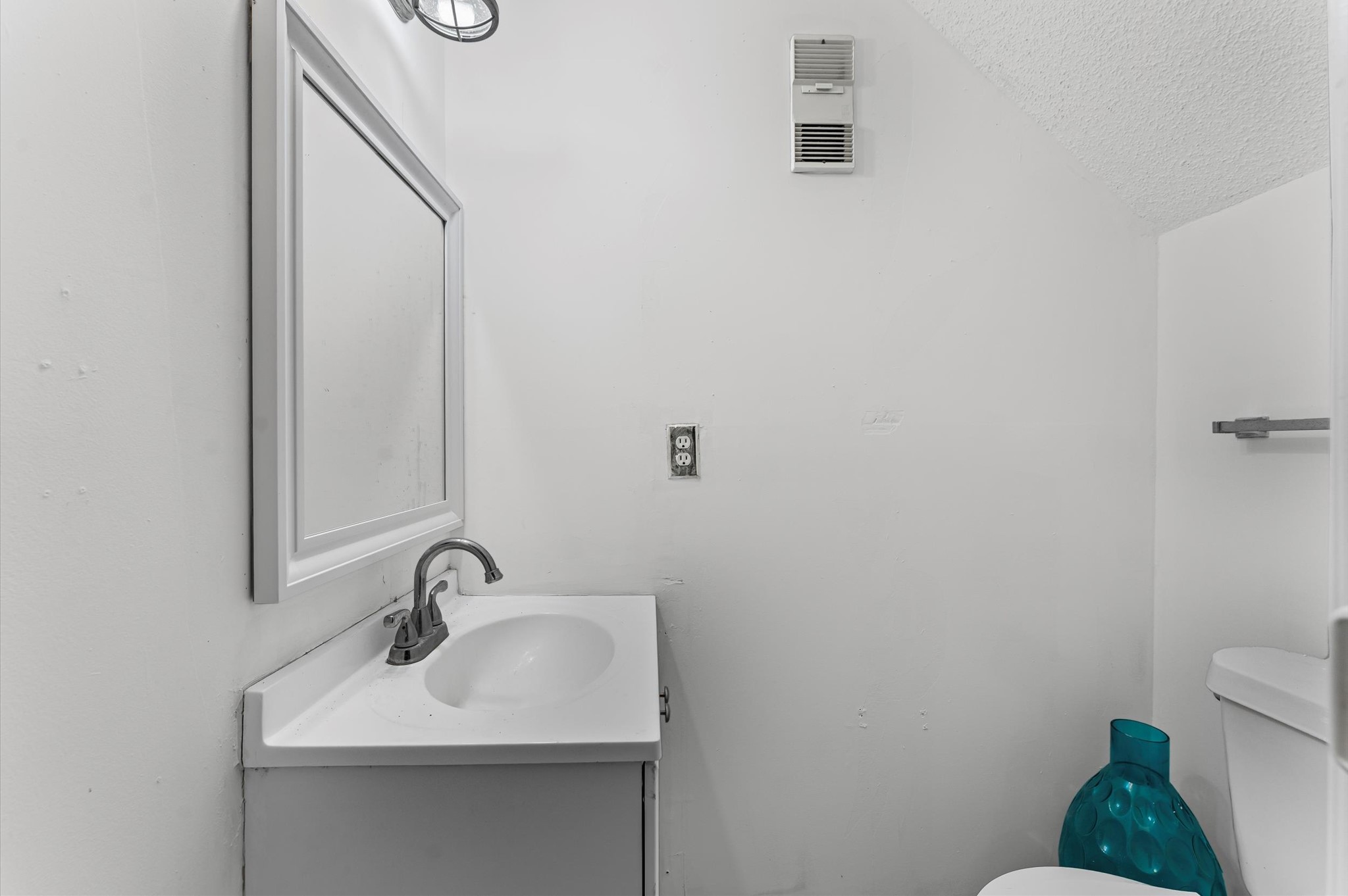 7402 Alabonson Road, Unit 303 Houston, TX 77088 - Photo 10 of 20 a bathroom with a sink and a toilet