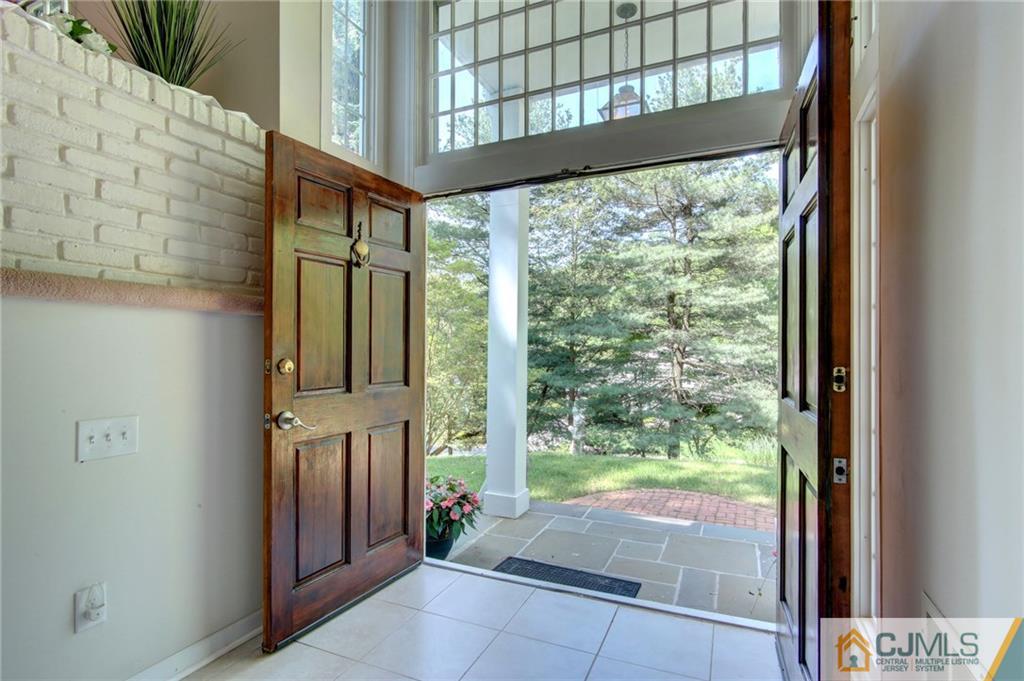 50 Wallace Road Middletown, NJ 07748 - Photo 12 of 24 a porch with a glass door