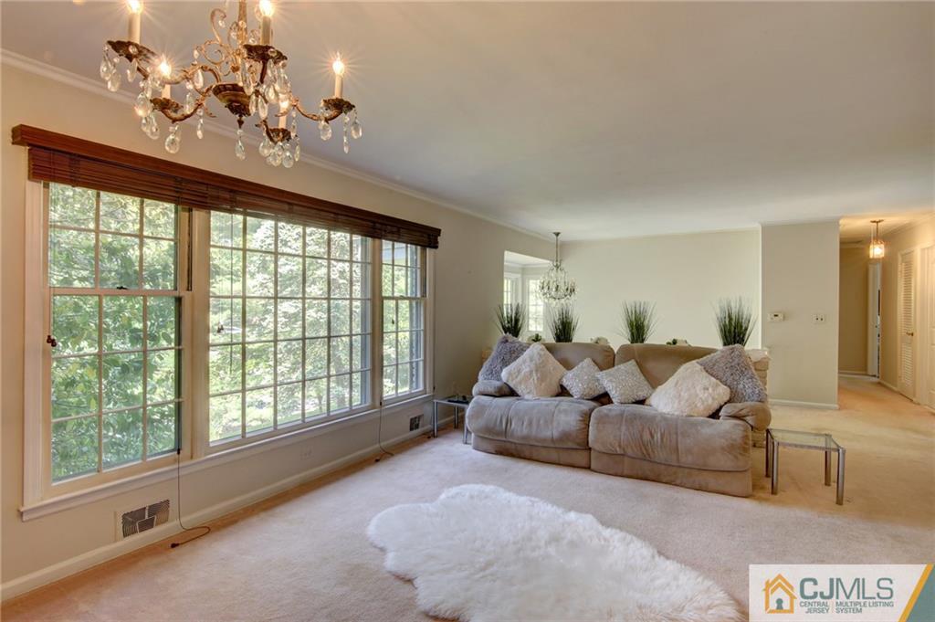 50 Wallace Road Middletown, NJ 07748 - Photo 13 of 24 a living room with furniture and a large window
