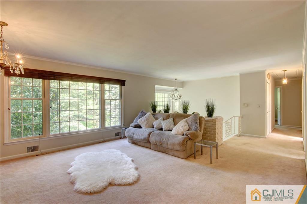 50 Wallace Road Middletown, NJ 07748 - Photo 14 of 24 a spacious bedroom with a bed and glass window