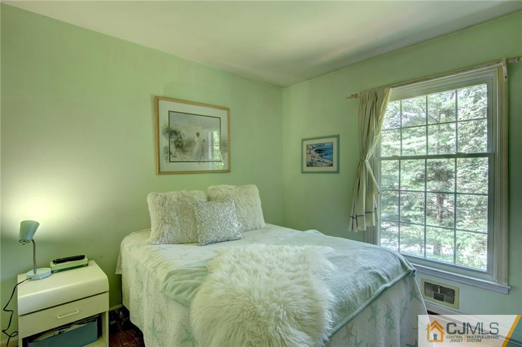 50 Wallace Road Middletown, NJ 07748 - Photo 17 of 24 a bedroom with a bed and a window