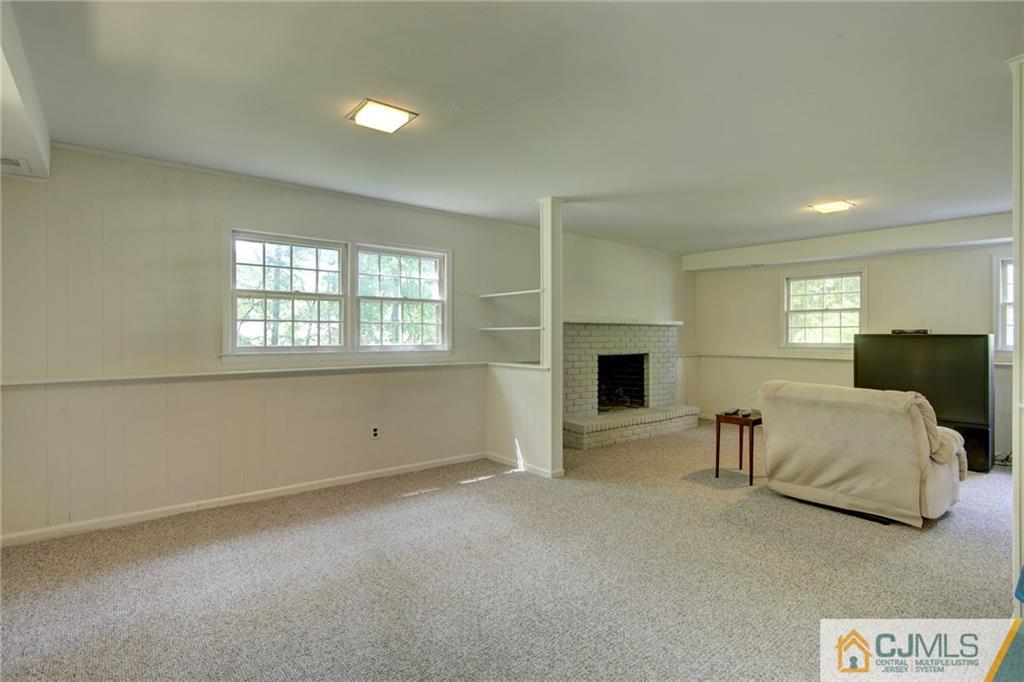 50 Wallace Road Middletown, NJ 07748 - Photo 20 of 24 a view of empty room with a window and fireplace