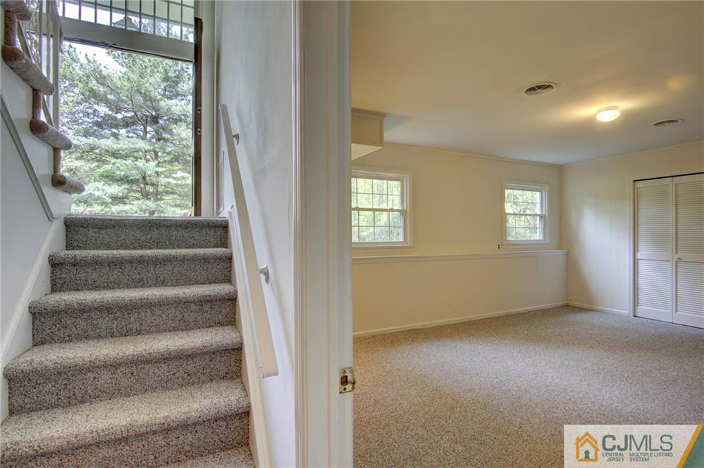 50 Wallace Road Middletown, NJ 07748 - Photo 22 of 24 a view of an empty room with a window