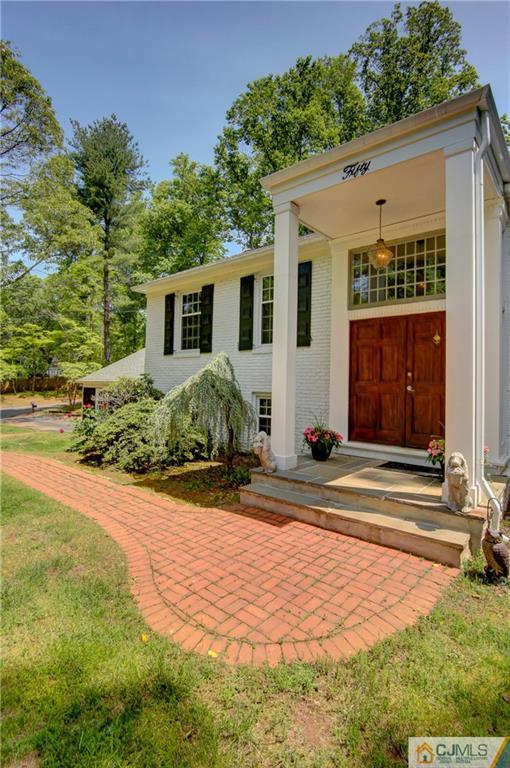 50 Wallace Road Middletown, NJ 07748 - Photo 4 of 24 a front view of a house with garden