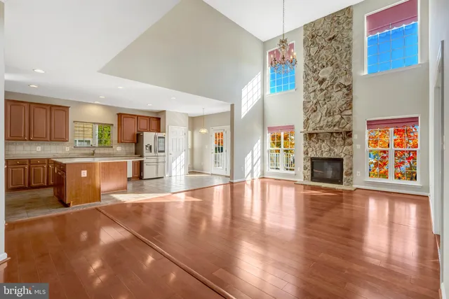 a bathroom with a double vanity sink a mirror and a window
