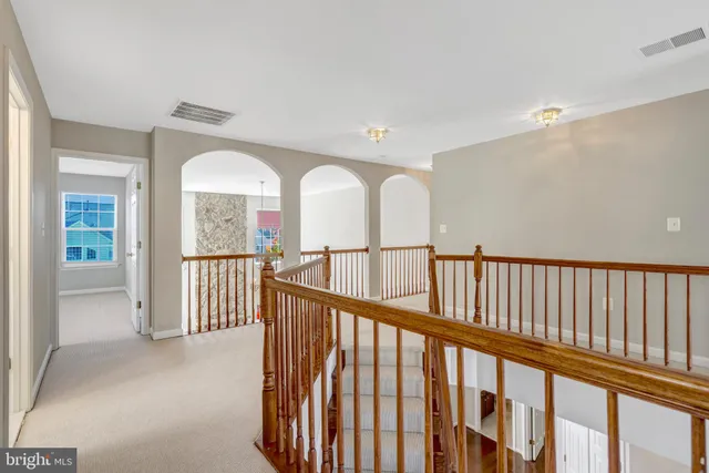 a view of an empty room and closet area