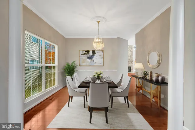a view of a room with wooden floor and window
