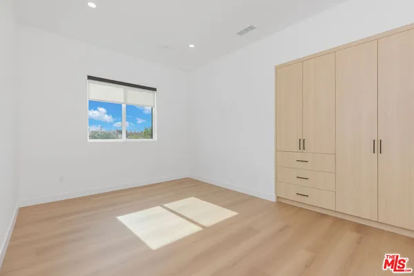 an empty room with cabinet