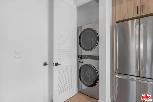 a view of a hallway with washer and dryer
