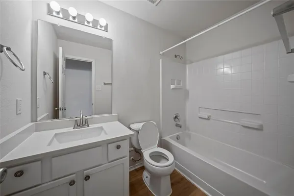 a bathroom with a sink toilet a shower and bathtub