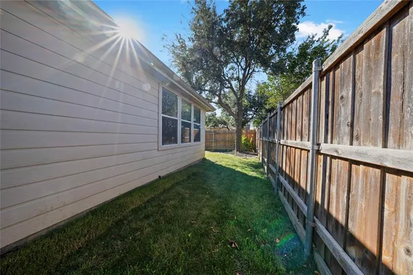 a view of backyard with green space