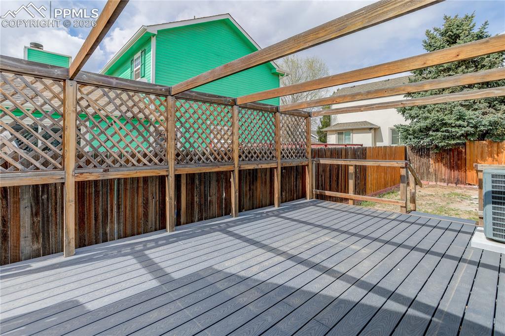 4770 Spacewalk Way Colorado Springs, CO 80916 - Photo 16 of 17 Composite deck w/ pergola framing