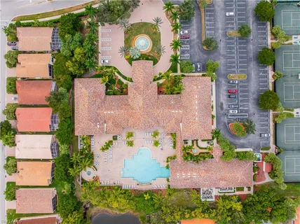 an aerial view of house with yard swimming pool and outdoor seating