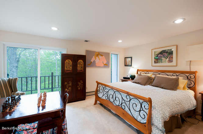 222 Whitman Road Hancock, MA 01267 - Photo 14 of 36 a bed room with a bed and a large window