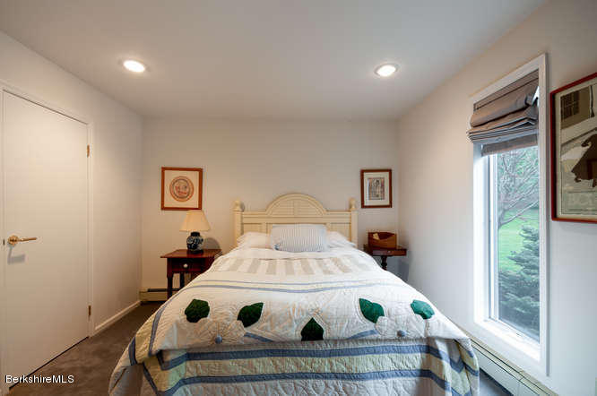 222 Whitman Road Hancock, MA 01267 - Photo 22 of 36 a bedroom with a bed and a window