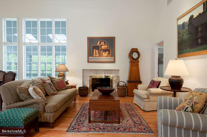 222 Whitman Road Hancock, MA 01267 - Photo 8 of 36 a living room with furniture a flat screen tv and a fireplace