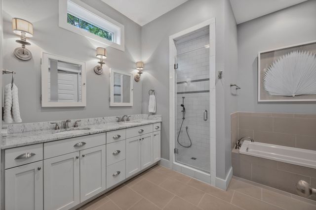 a bathroom with a bathtub and a shower