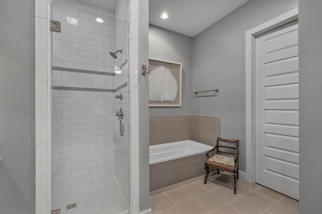 a en suite bathroom with double sink and a mirror