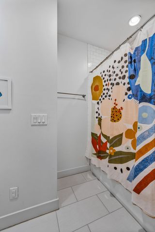 a bed room with bed and a tv