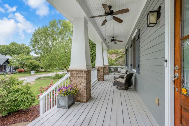 a view of room with stairs and wooden floor