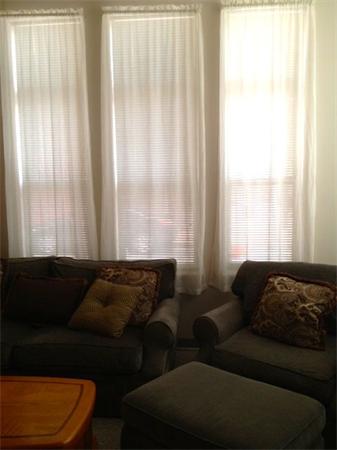985 Tremont Street, Unit 985 Boston, MA 02120 - Photo 9 of 12 a living room with furniture and a window