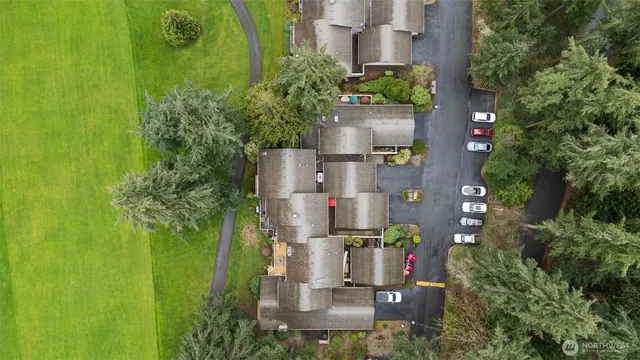 an aerial view of a house with a yard