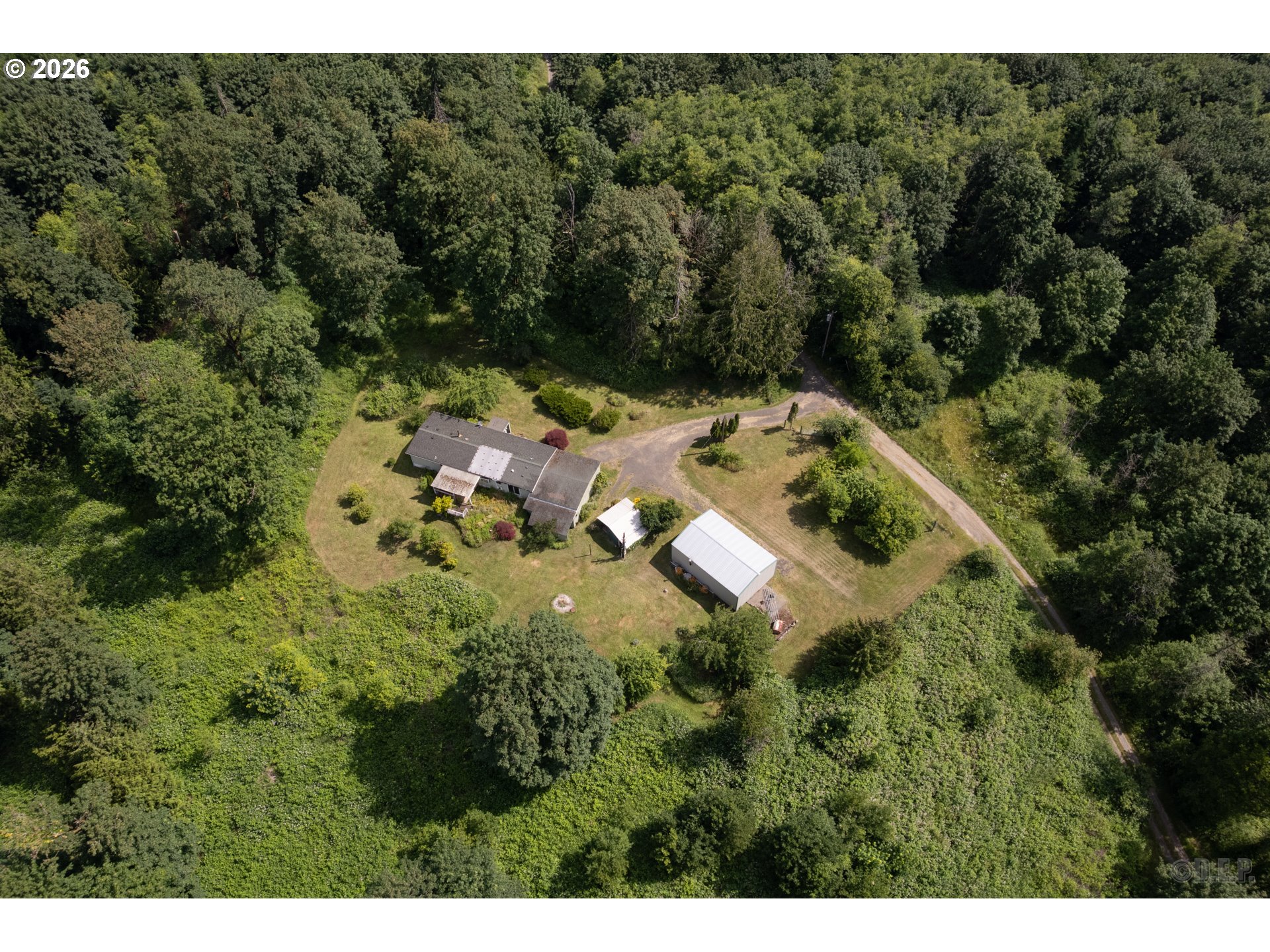 66971 Maplecrest Road Deer Island, OR 97054 - Photo 2 of 24 a view of a house with a yard