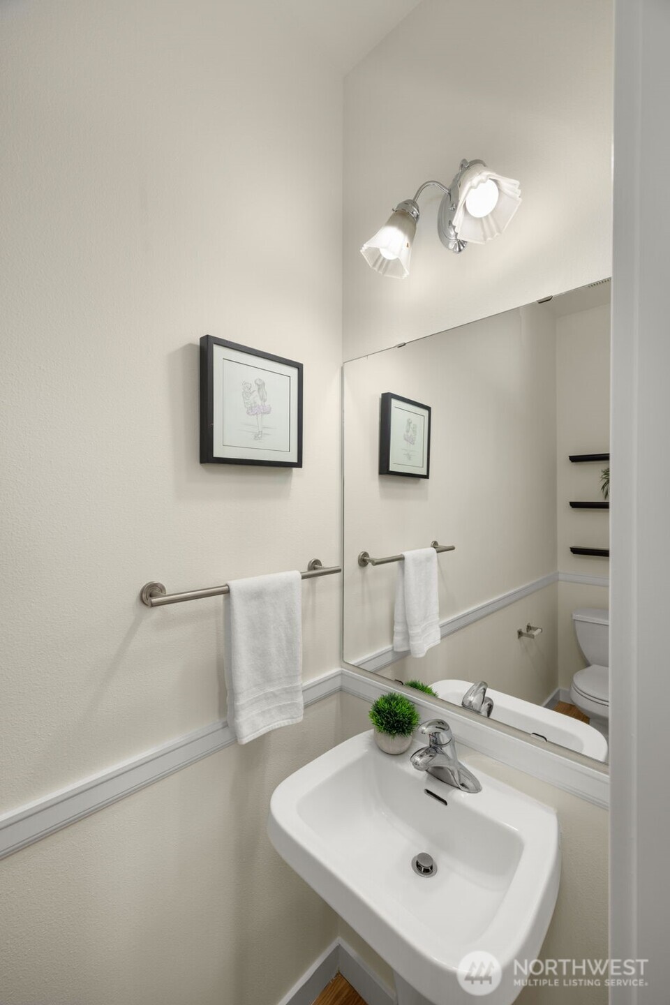 23120 Southeast Black Nugget Road, Unit C1 Issaquah, WA 98029 - Photo 11 of 31 a bathroom with a sink and a mirror