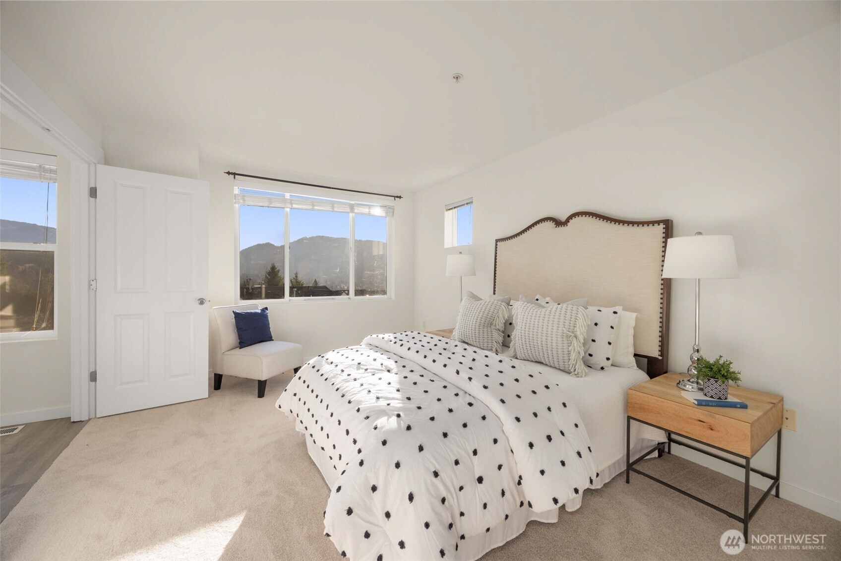 23120 Southeast Black Nugget Road, Unit C1 Issaquah, WA 98029 - Photo 12 of 31 a bedroom with a bed and a window