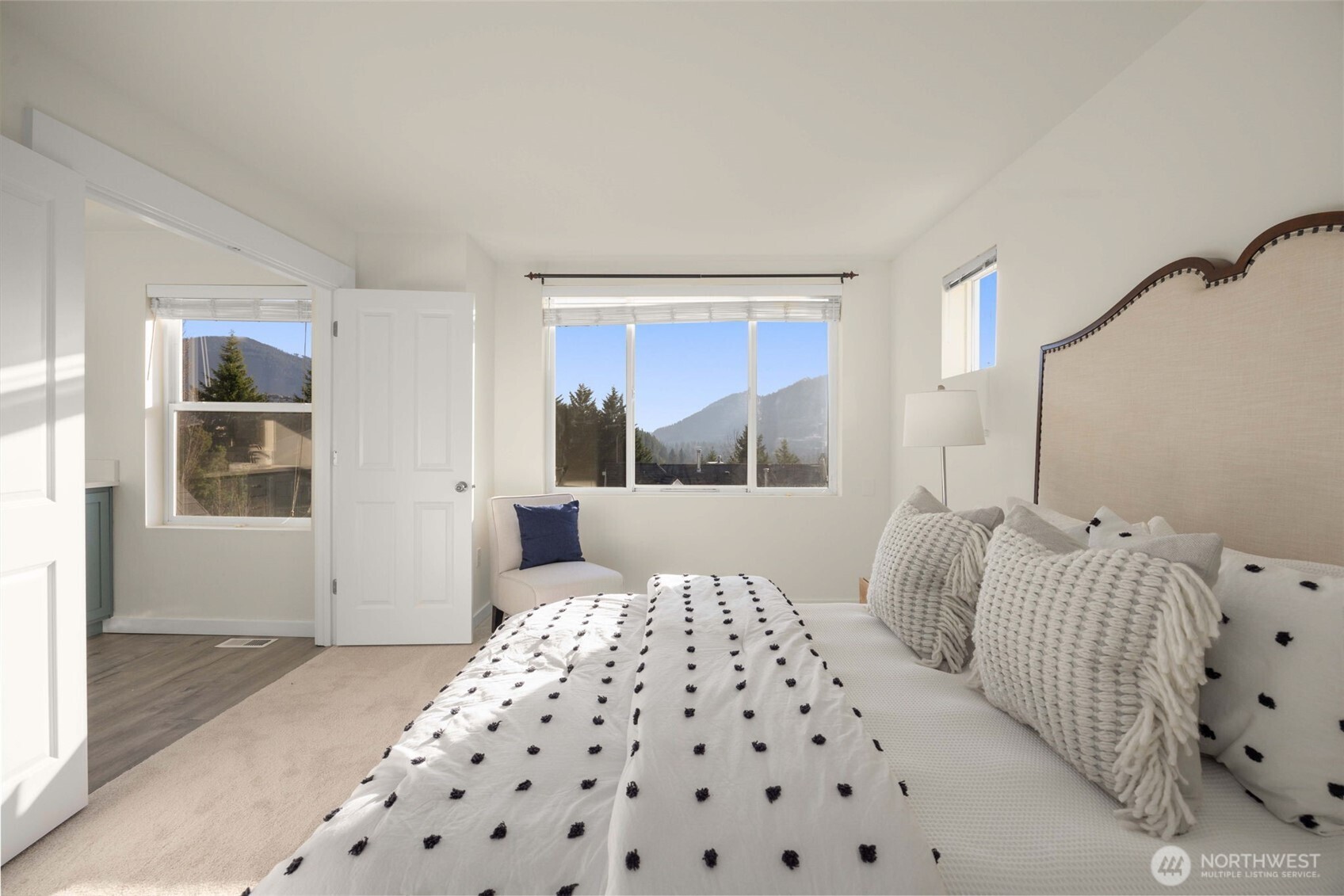 23120 Southeast Black Nugget Road, Unit C1 Issaquah, WA 98029 - Photo 13 of 31 a bedroom with a large bed and a window