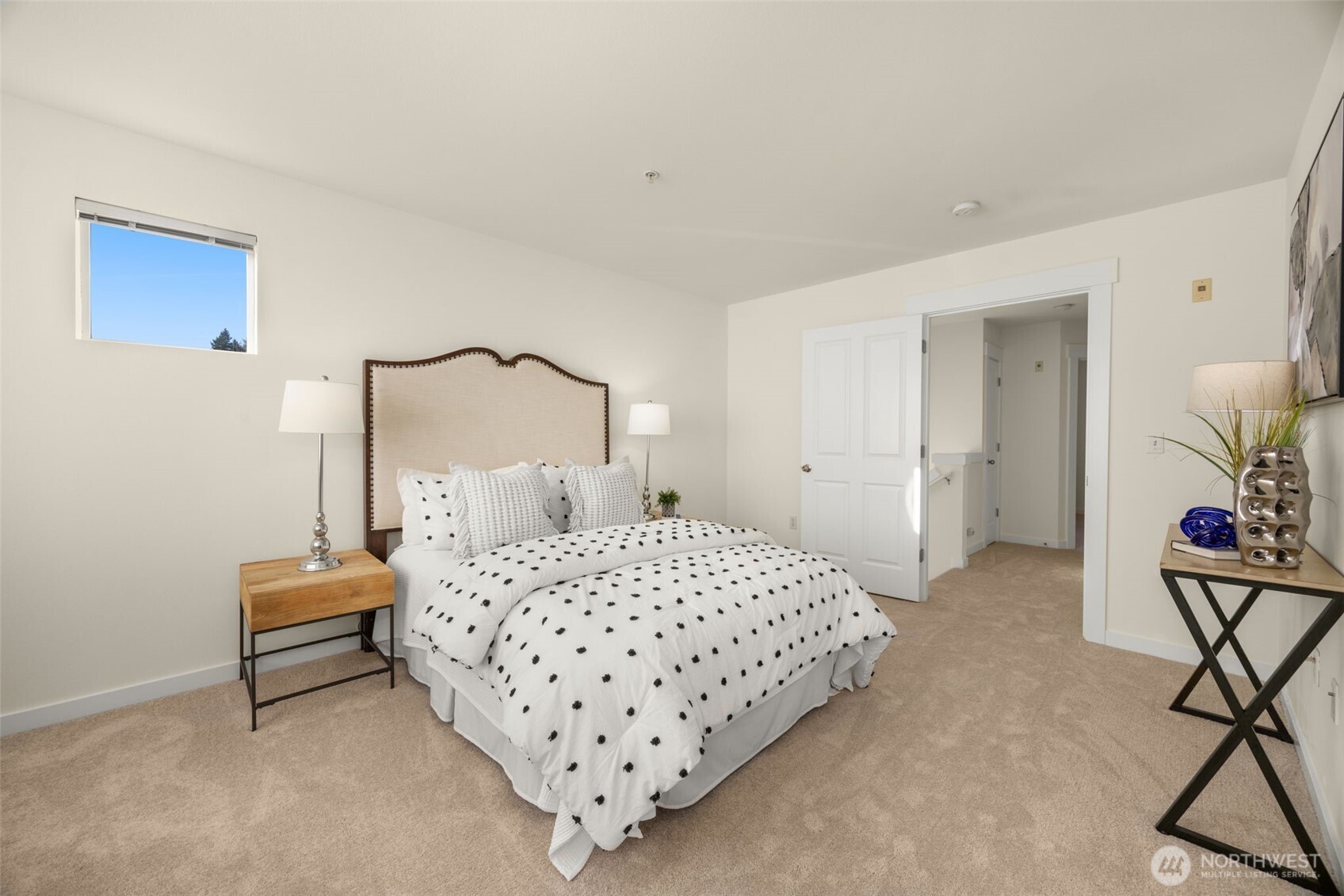 23120 Southeast Black Nugget Road, Unit C1 Issaquah, WA 98029 - Photo 14 of 31 a bedroom with a bed and a chair