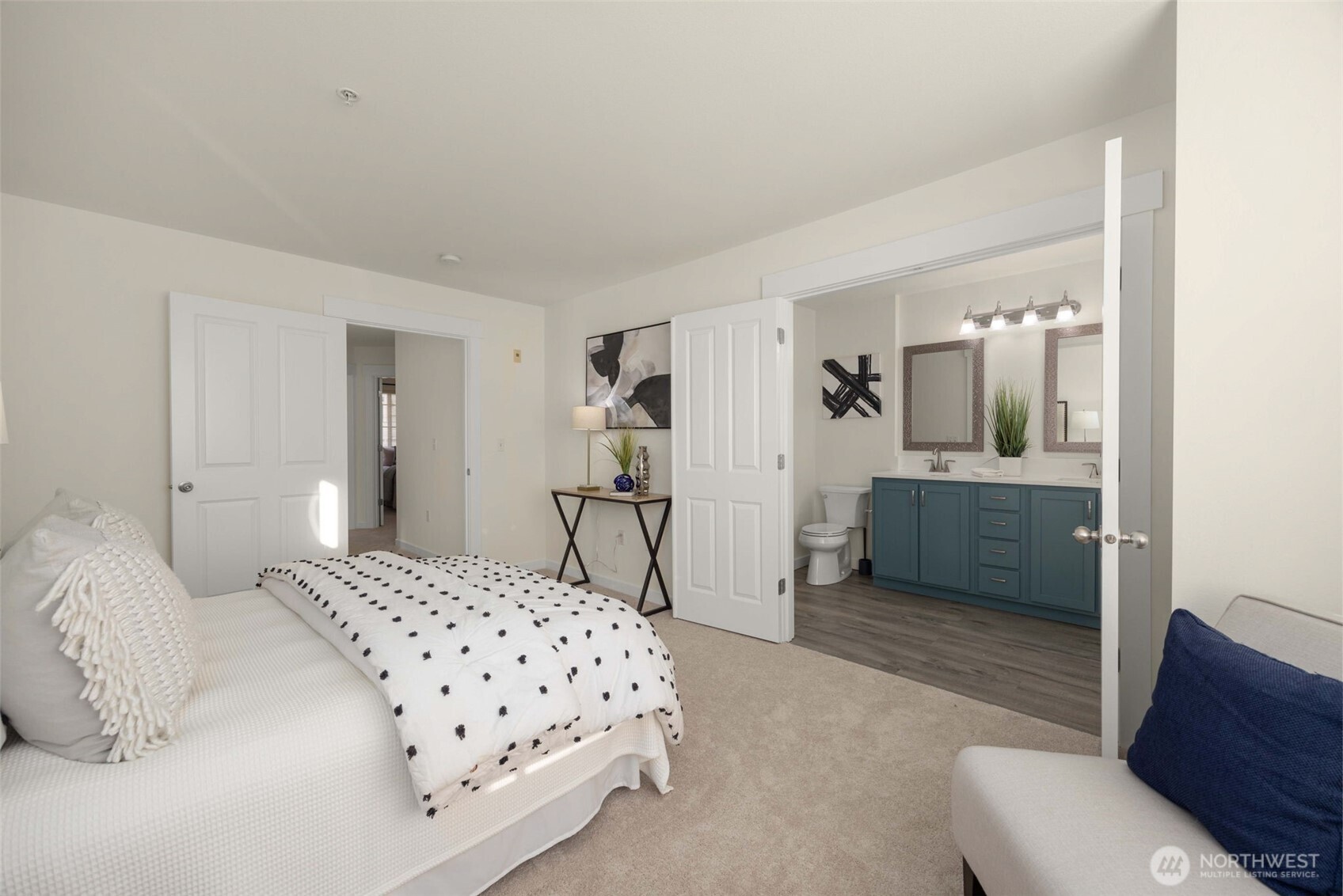 23120 Southeast Black Nugget Road, Unit C1 Issaquah, WA 98029 - Photo 15 of 31 a bedroom with a bed and a couch