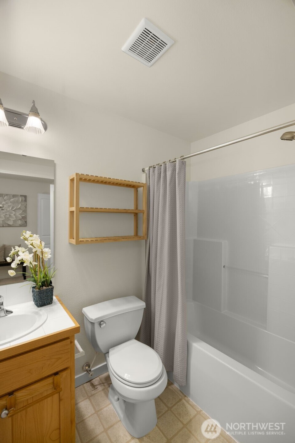 23120 Southeast Black Nugget Road, Unit C1 Issaquah, WA 98029 - Photo 24 of 31 a bathroom with a sink a toilet and shower