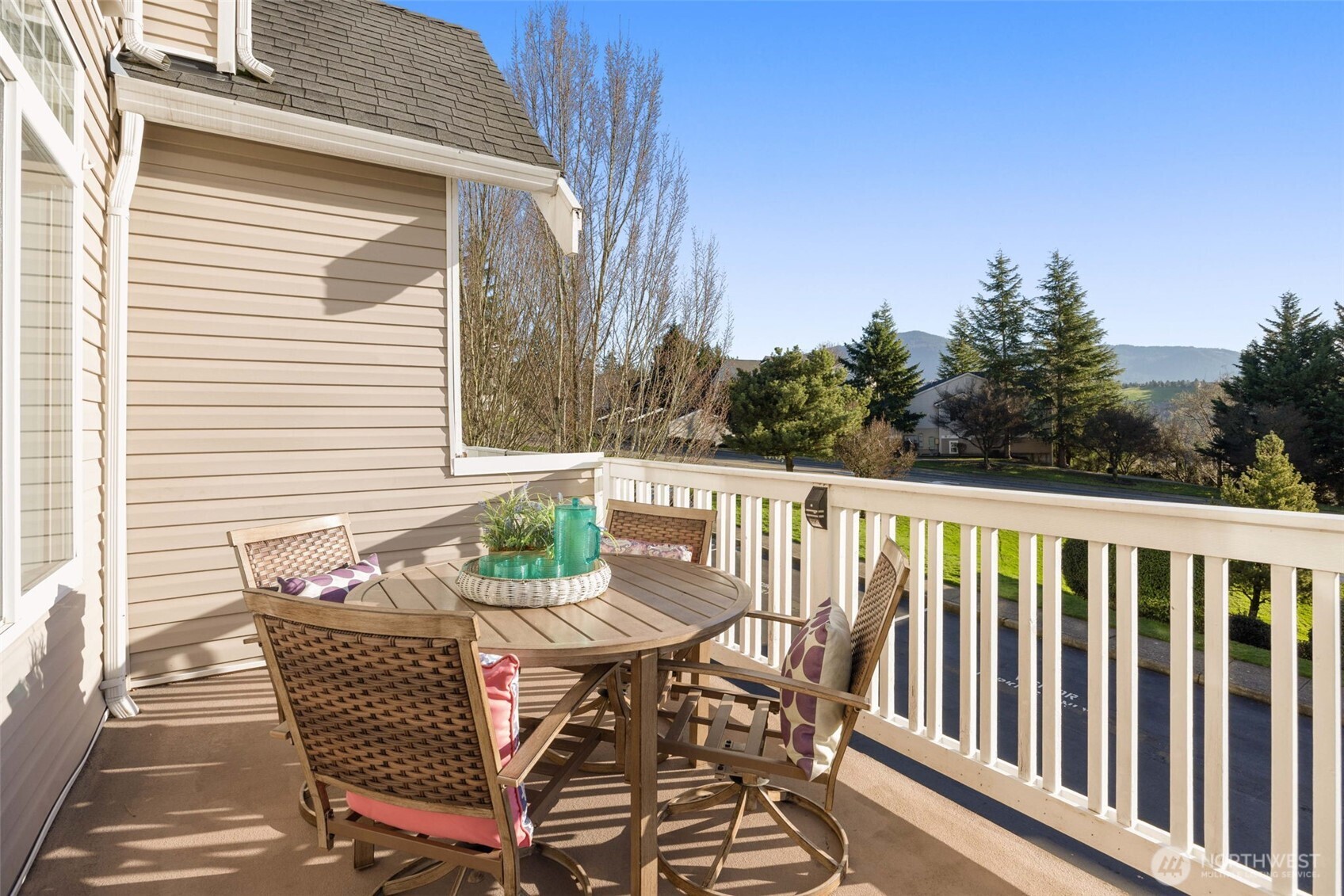 23120 Southeast Black Nugget Road, Unit C1 Issaquah, WA 98029 - Photo 5 of 31 a view of a chairs and table on the deck