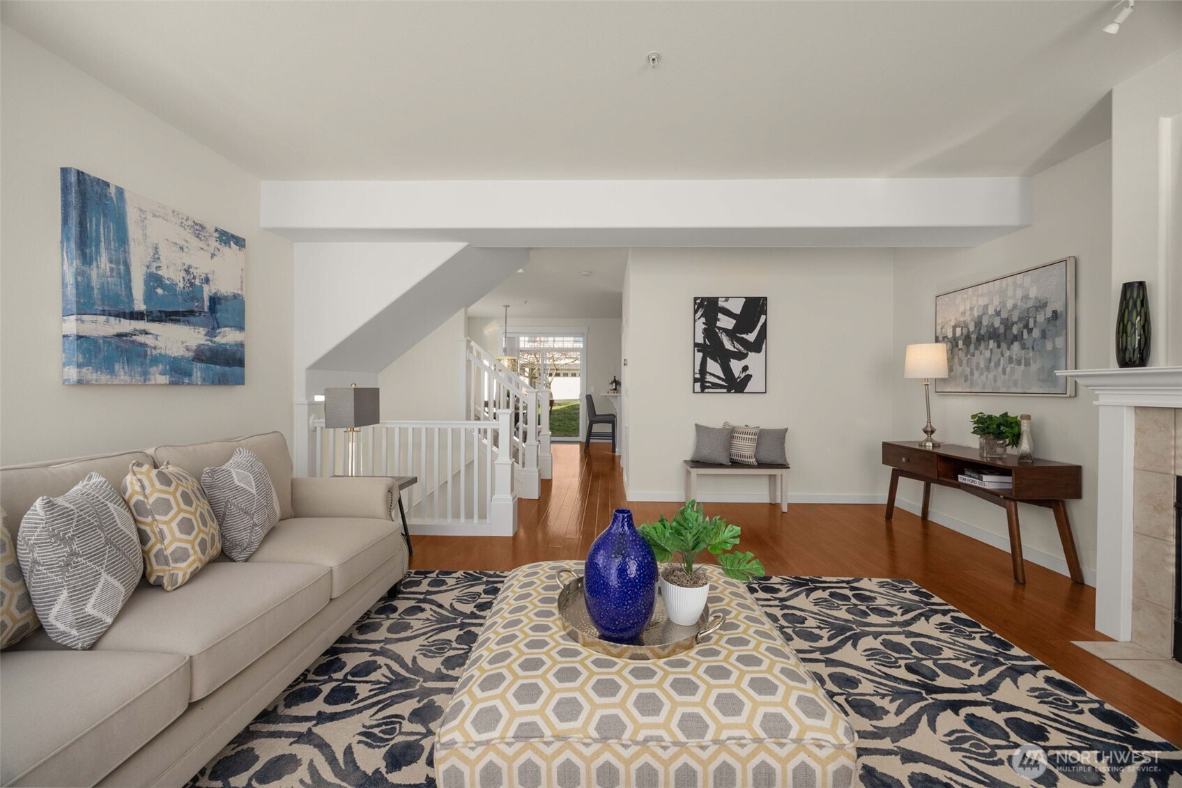 23120 Southeast Black Nugget Road, Unit C1 Issaquah, WA 98029 - Photo 6 of 31 a living room with furniture and painting on the wall