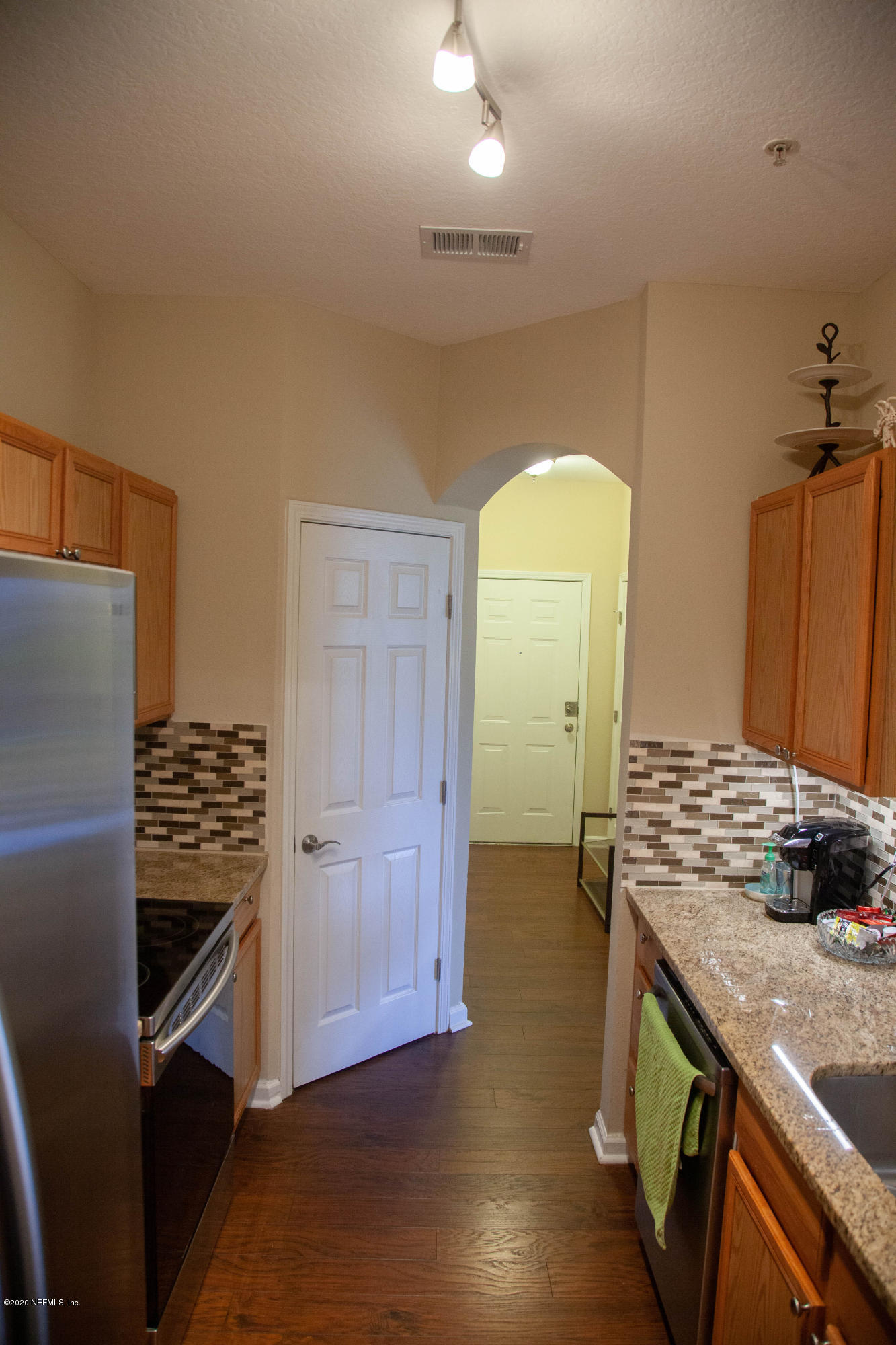 7990 Baymeadows Road, Unit 403 Jacksonville, FL 32256 - Photo 6 of 55 a kitchen with stainless steel appliances granite countertop a stove and a refrigerator