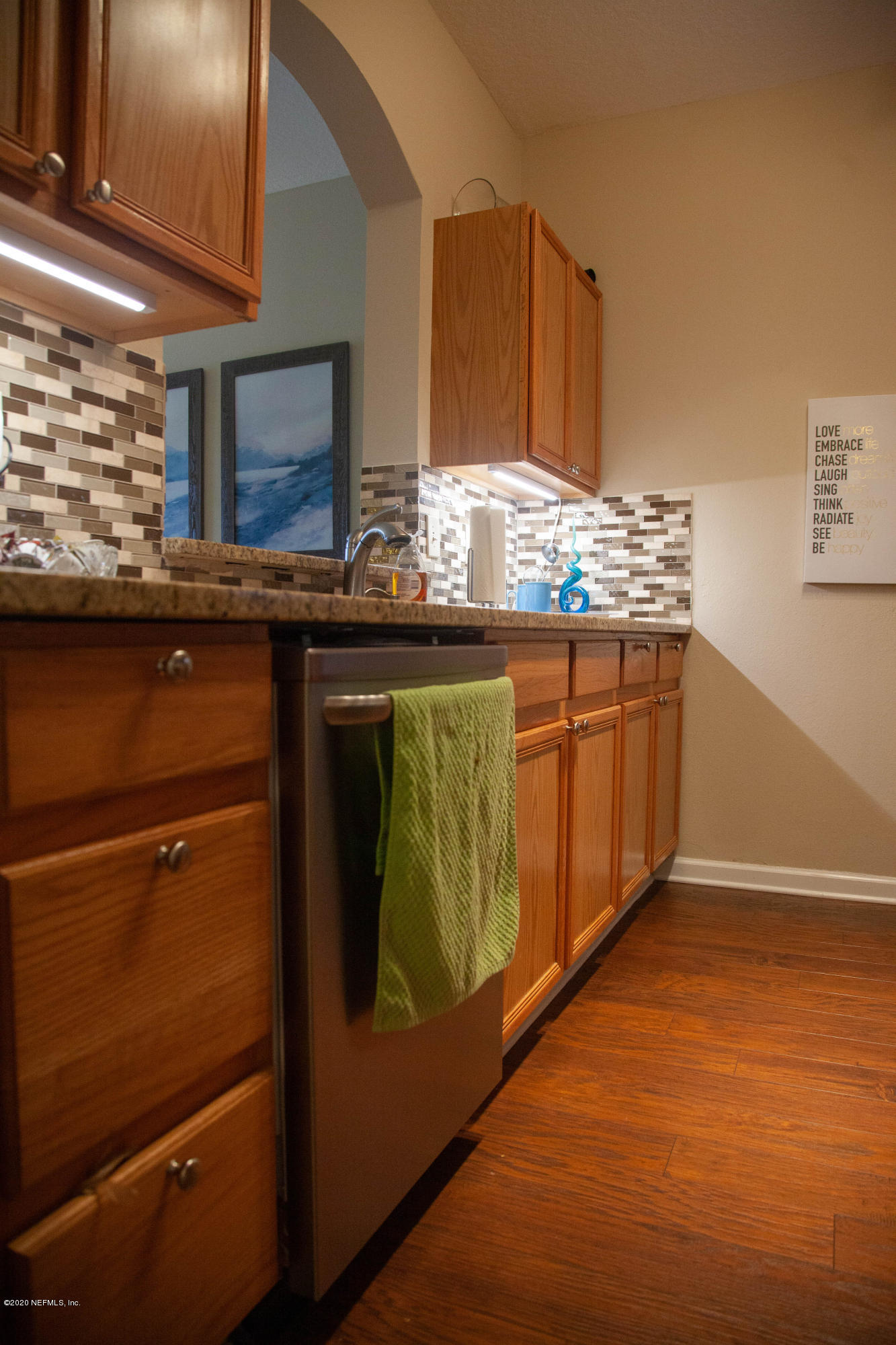 7990 Baymeadows Road, Unit 403 Jacksonville, FL 32256 - Photo 8 of 55 a kitchen with stainless steel appliances granite countertop a refrigerator and a stove