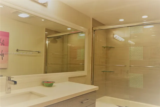 a bathroom with a sink and a shower