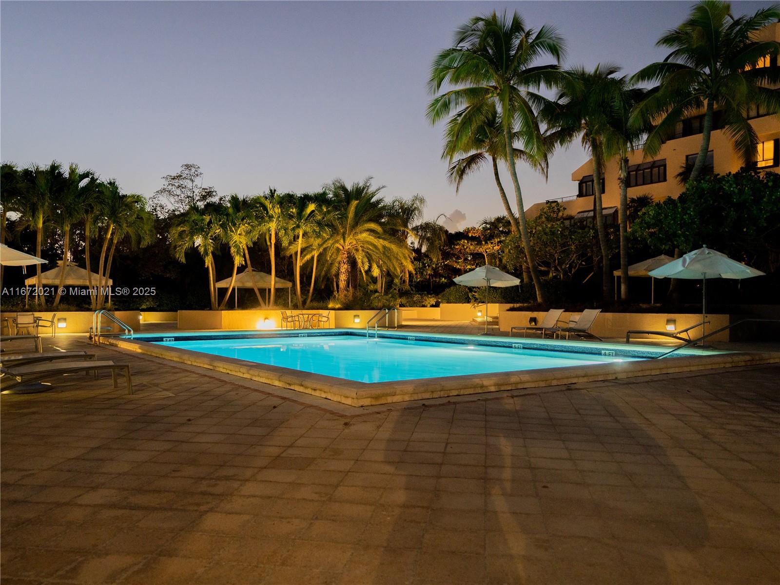 151 Crandon Boulevard, Unit 430 Key Biscayne, FL 33149 - Photo 20 of 26 a view of a yard with swimming pool