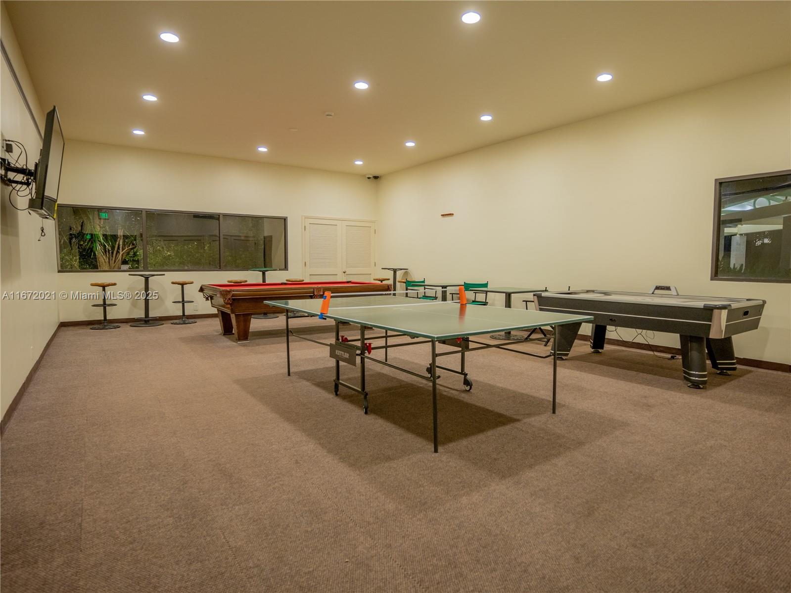 151 Crandon Boulevard, Unit 430 Key Biscayne, FL 33149 - Photo 25 of 26 a living room with furniture and a pool table