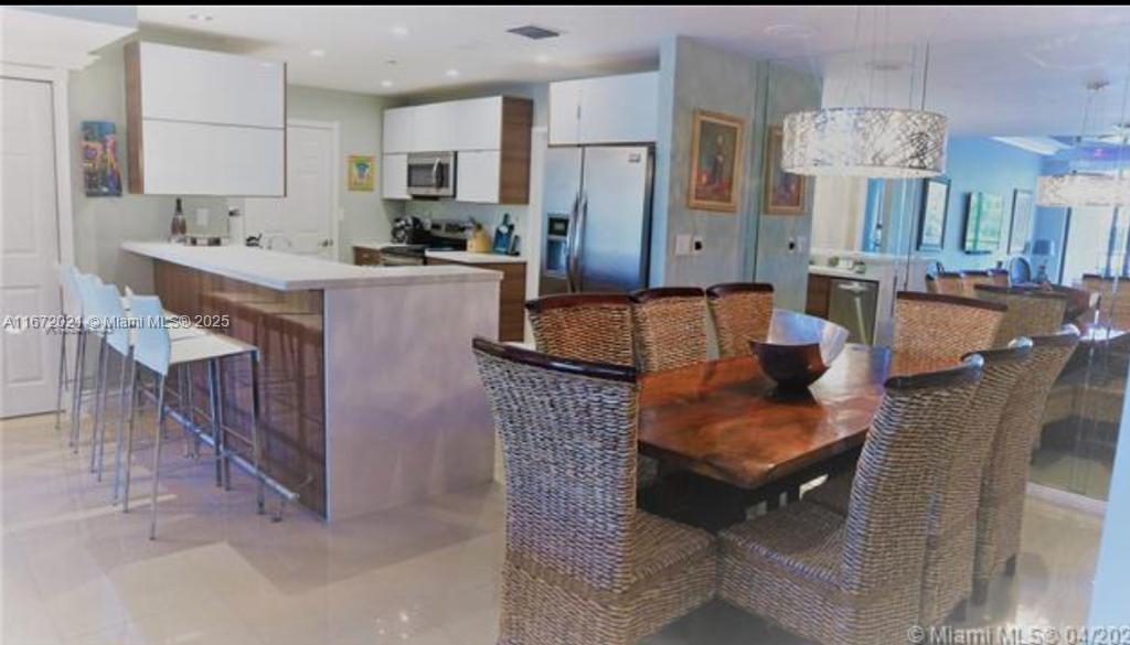 151 Crandon Boulevard, Unit 430 Key Biscayne, FL 33149 - Photo 26 of 26 a living room with stainless steel appliances kitchen island granite countertop furniture and a kitchen view