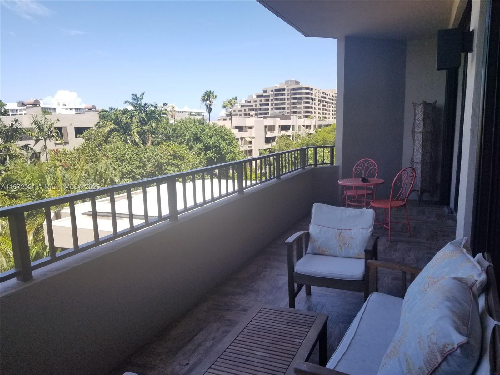 151 Crandon Boulevard, Unit 430 Key Biscayne, FL 33149 - Photo 5 of 26 a view of balcony with furniture
